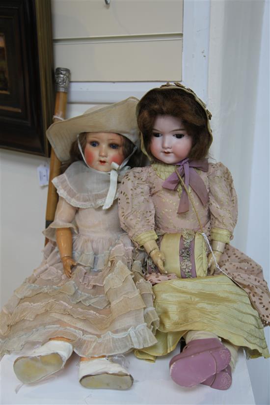 An Armand Marseille bisque headed doll & another doll